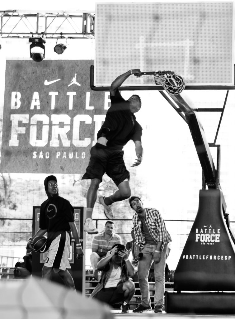 monochrome-photo-of-man-dunking-on-basketball-ring-1839834